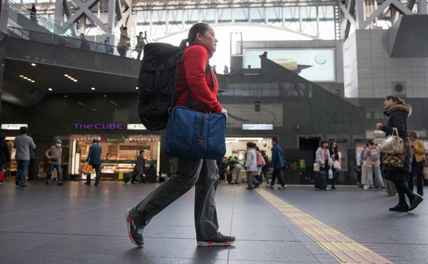 A person carrying a Pilot through the airport.